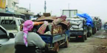 Thousands flee north-west Syria amid fierce assault by Assad