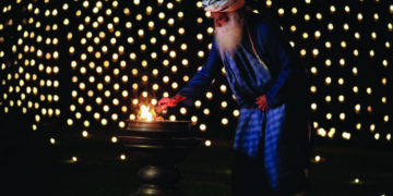 Sadguru Jaggi Vasudev lits lamp at Isha Yoga Foundation