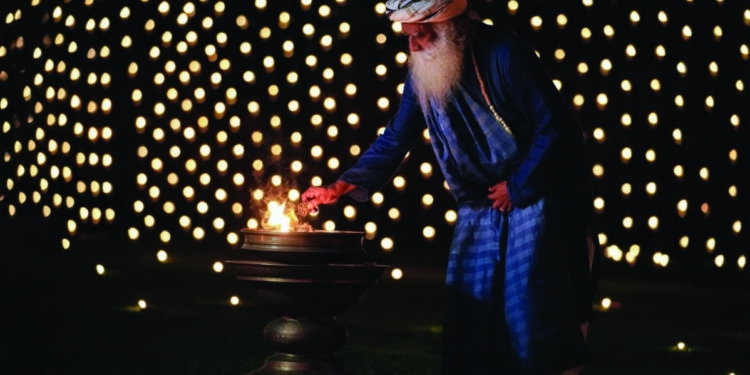 Sadguru Jaggi Vasudev lits lamp at Isha Yoga Foundation