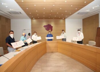 CM releases Gujarat Postal Dept’s special charity cover on ‘Art of Living with COVID-19’