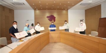 CM releases Gujarat Postal Dept’s special charity cover on ‘Art of Living with COVID-19’