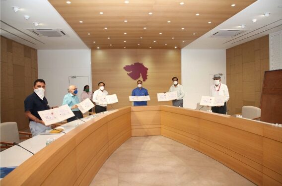 CM releases Gujarat Postal Dept’s special charity cover on ‘Art of Living with COVID-19’