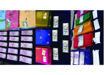 Haul of currencies concealed in dress material; 2 held