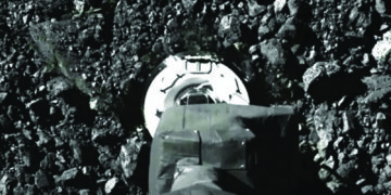 Asteroid samples escaping from jammed NASA spacecraft