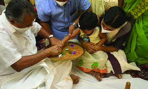 Amid strict COVID protocols, tiny tots in Kerala initiated into world of letters
