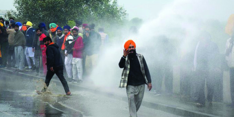 Protest against farm laws: Delhi Police uses tear gas, water cannons to push back farmers