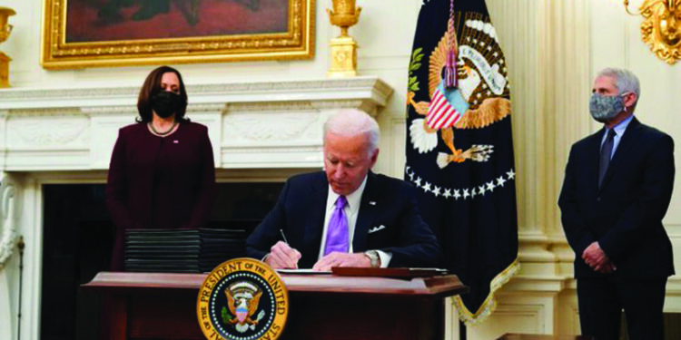 Testing wristbands, masks a sign of new boss at White House