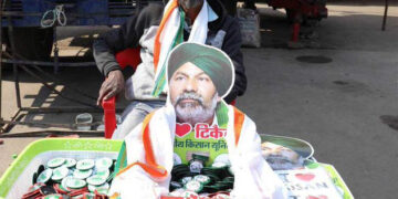 At Singhu border, Rakesh Tikait’s cutouts, posters & badges of farmers stir draw crowd