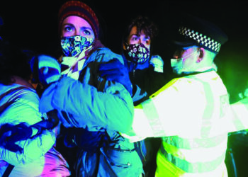 Police clash with participants of UK vigil for slain woman