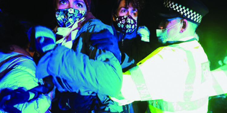 Police clash with participants of UK vigil for slain woman