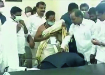 Throwing all norms Dist Collector falls at KCR’s feet in Telangana, Opposition parties castigate him