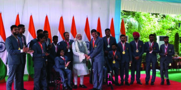 PM hosts India Paralympic contingent, presented with autographed stole