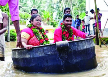 Brave bride, groom travel in cooking vessel, get married amidst rising floods in God’s Own Country