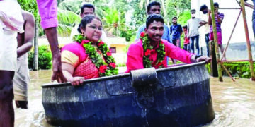Brave bride, groom travel in cooking vessel, get married amidst rising floods in God’s Own Country