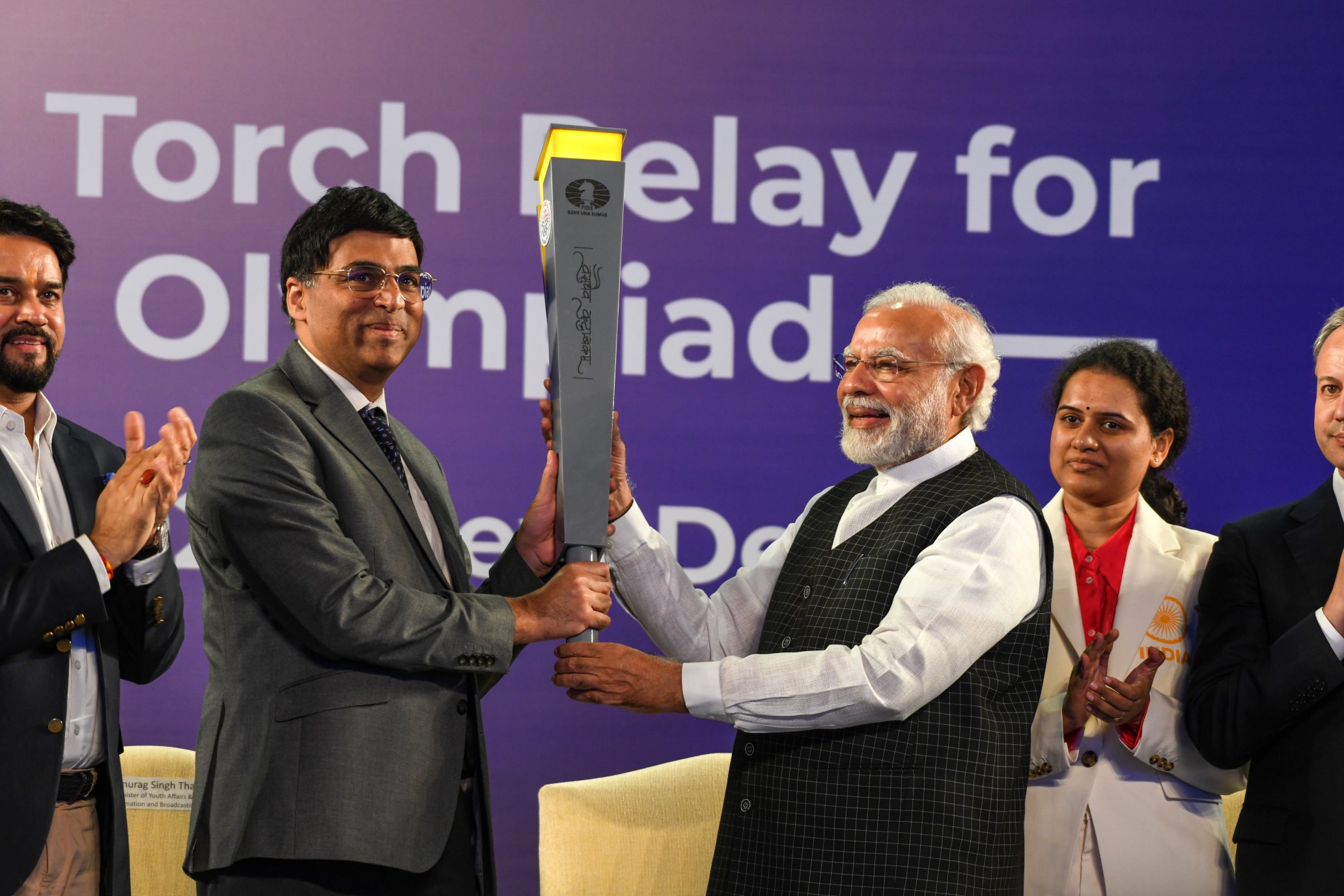 Yogi hands over Chess Olympiad torch to Viswanathan Anand