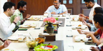 BJP, Cong dub Kejriwal’s lunch with family of Gujarat sanitation worker ‘political stunt’