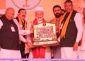 Upcoming ‘Dhaman’ movie producer Bhupat Bodar presents memento to PM Modi in Dhoraji