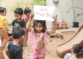 Nurture Preschool, South Bopal, kids have fun with mud on International Mud Day
