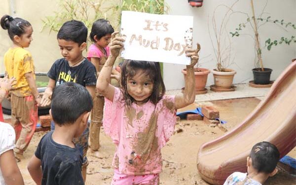 Nurture Preschool, South Bopal, kids have fun with mud on International Mud Day