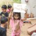 Nurture Preschool, South Bopal, kids have fun with mud on International Mud Day