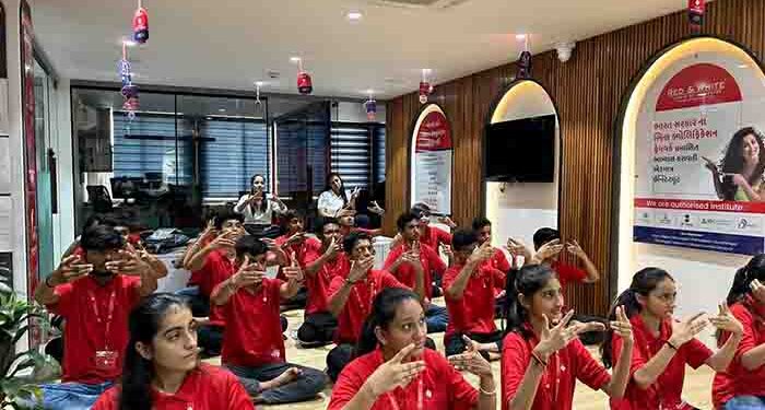 IYD feat: Students of Red & White Institute perform yoga postures on the longest day of the year